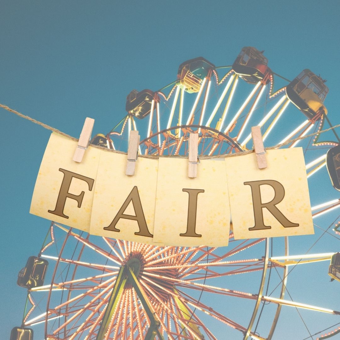 image of a fair ride and a hanging by a  thread of yarn "fair"  sign