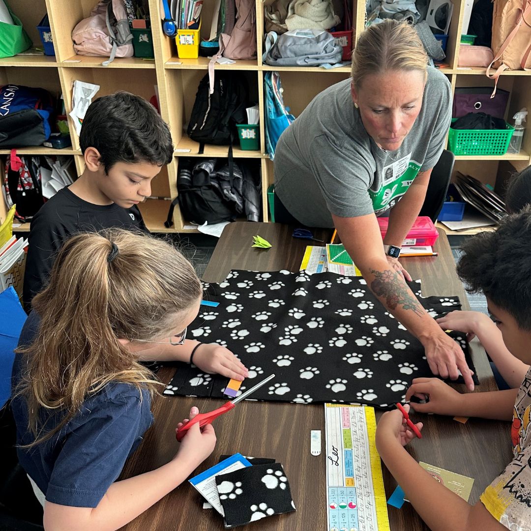 4H leader guiding students in an activity
