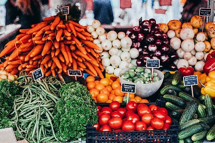 Farmers market table with a wide-range of vegetables for purchase
